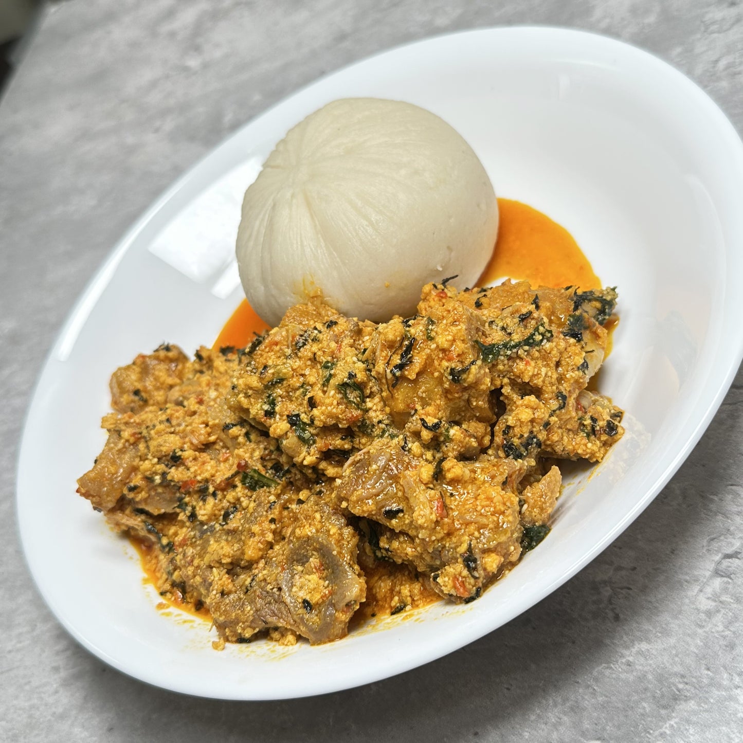 Egusi soup and poundo yam